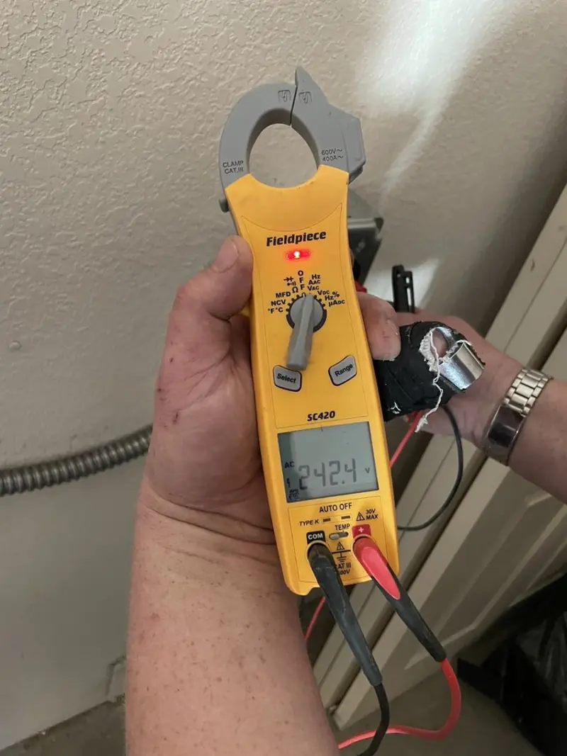 Voltage testing with clamp meter during Ceiling Fan Installation in Charleston